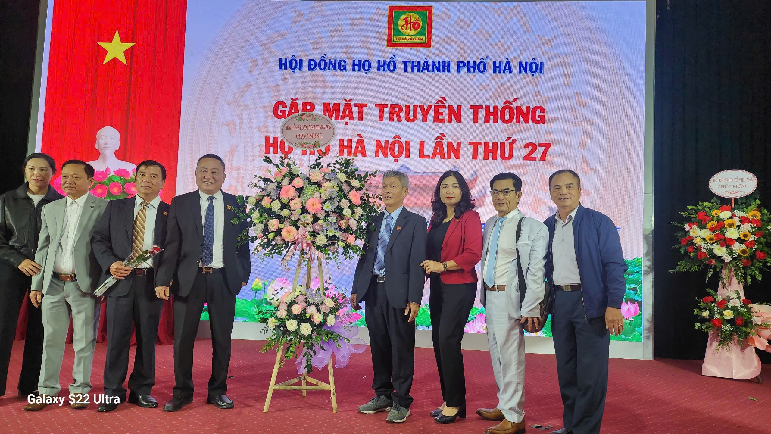 A group of people standing in front of a large sign

AI-generated content may be incorrect.